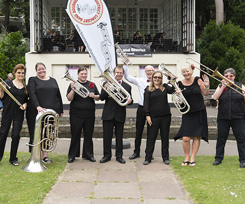 Our brass players standing in front of Bournemouth bandstand