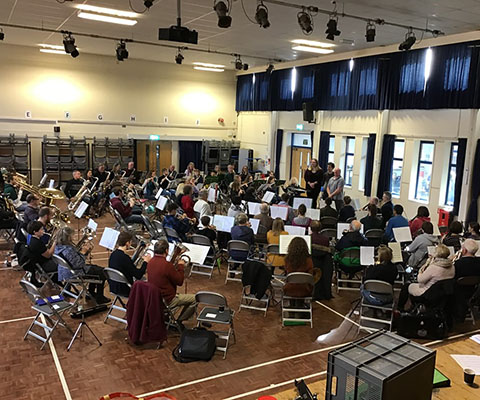 100+ musicians rehearse for massed bands concert in March