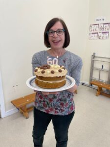 Angela holding birthday cake