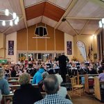 Audience listening to band play at autumn concert