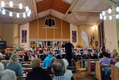 Audience listening to band play at autumn concert