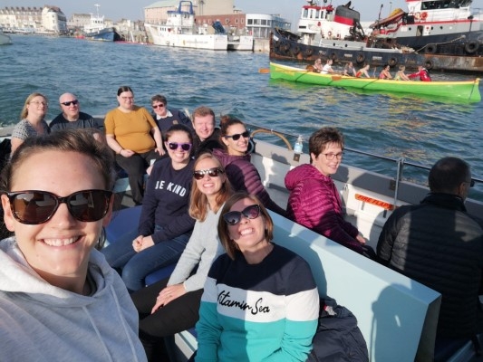 Band members on boat taking selfie