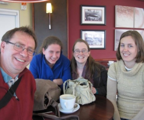 Band members sitting smiling for camera