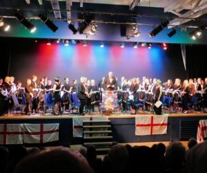 Band members on stage at The Verwood Hub