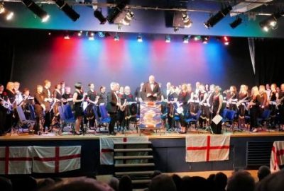 Band members on stage at The Verwood Hub