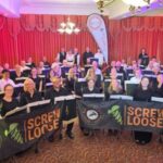 Band and Screw Loose smiling at camera