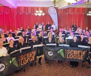 Band and Screw Loose smiling at camera