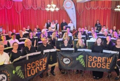 Band and Screw Loose smiling at camera