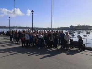 Band members on Falmouth pier ready for boat trip