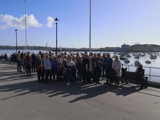 Band members on Falmouth pier ready for boat trip