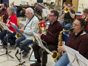 Martin playing with saxophones