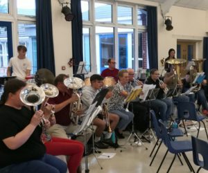 Our brass and percussion section at band rehearsal in school hall