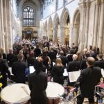 View of band and audience at concert in Wimborne Minster