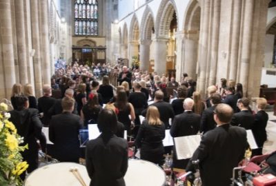 View of band and audience at concert in Wimborne Minster