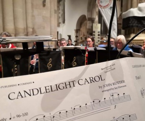 Candlelight Carol music on stand at Wimborne Minster